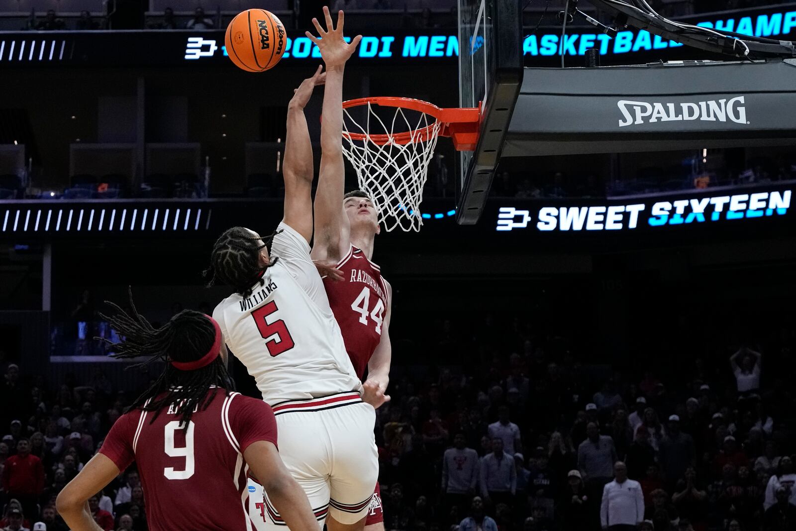 Texas Tech forward Darrion Williams (5) shoots against Arkansas forward Zvonimir Ivisic (44) during the second half in the Sweet 16 of the NCAA college basketball tournament, Thursday, March 27, 2025, in San Francisco. (AP Photo/Godofredo A. Vásquez)
