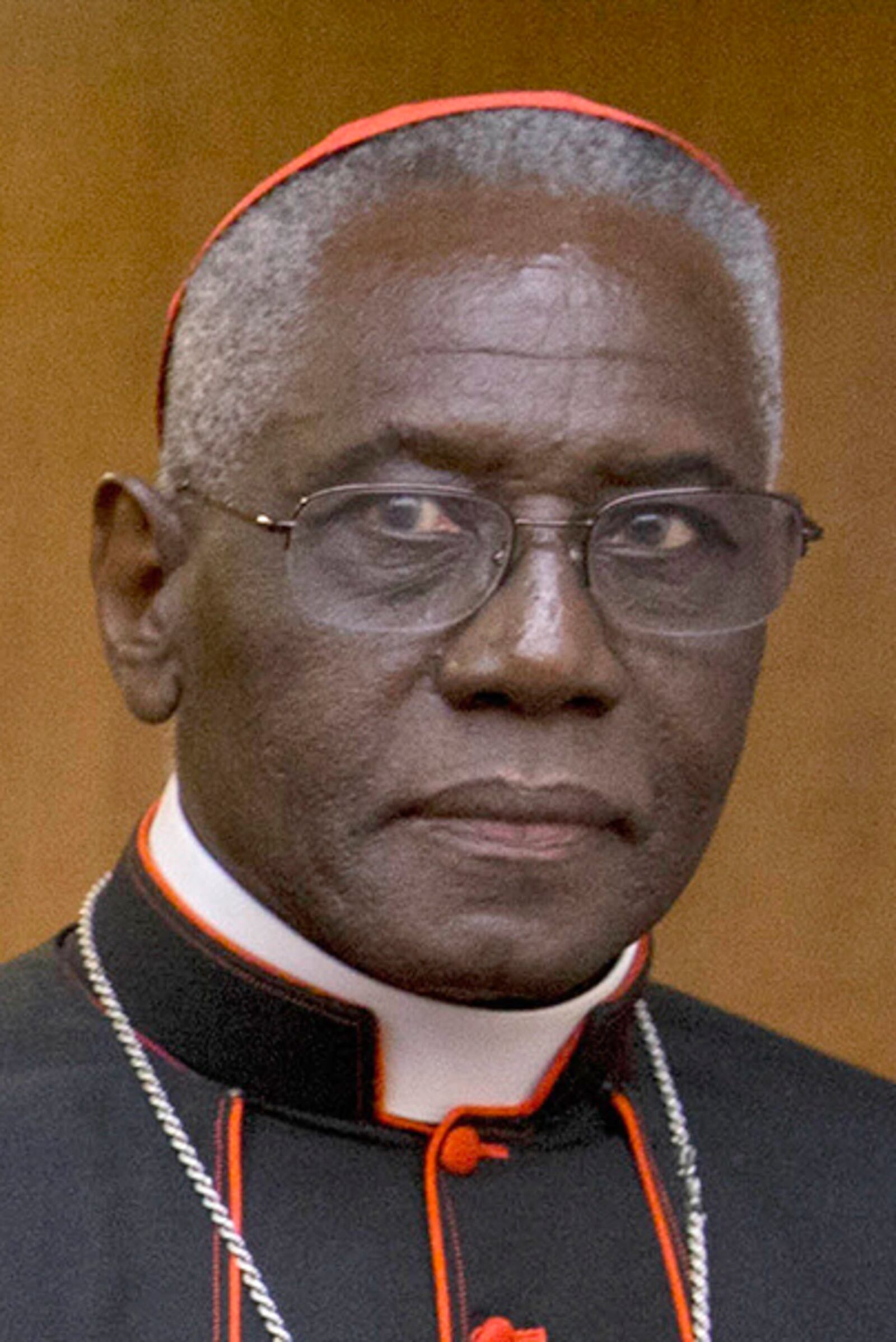 FILE - Cardinal Robert Sarah, prefect of the Congregation for Divine Worship and the Discipline of the Sacraments, arrives in Rome, Oct. 14, 2015. (AP Photo/Andrew Medichini, File)
