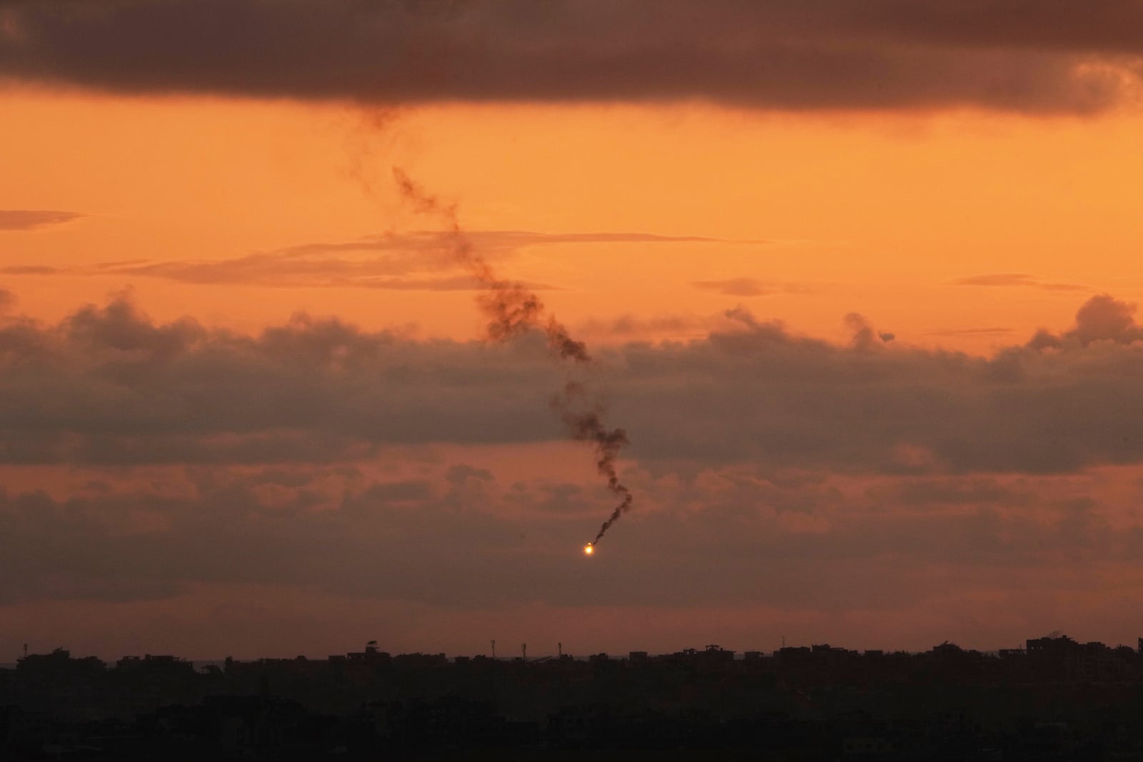 A flare fired by the Israeli army over the Gaza Strip is seen from southern Israel, Sunday, May 4, 2025. (AP Photo/Ariel Schalit)