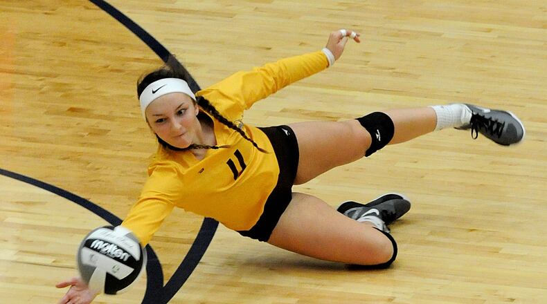 Kenton Ridge’s Dakota White, 11, makes a diving save duriing a Division II District Volleyball title match against Middletown Fenwick at Kettering Fairmont’s Trent Arena on Saturday, Oct. 30, 2016. David A. Moodie, contributing photographer