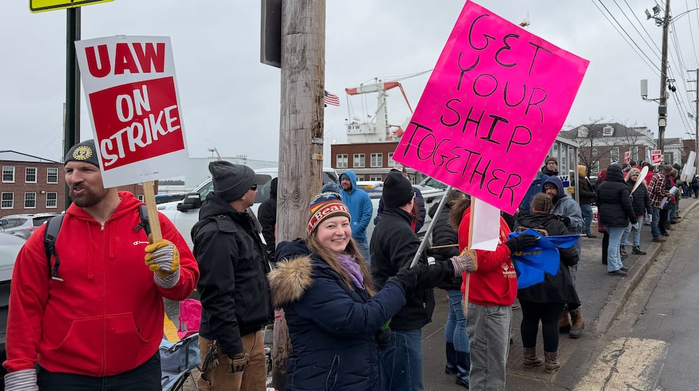FILE - Striking workers stage picket line outside Bath Iron Works in Bath, Maine, on Monday, May 23, 2026. (AP Photo/Rodrique Ngowi, File)