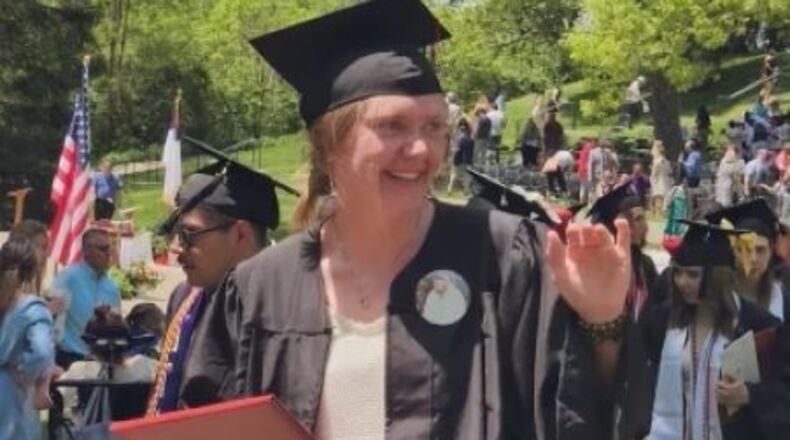 Kat Combs recently graduated from Wittenberg University and is working to help those with substance addiction issues and will perform a monologue in a show addressing such issues this weekend. She wore a button with her late father's photo as a tribute during her graduation ceremony.