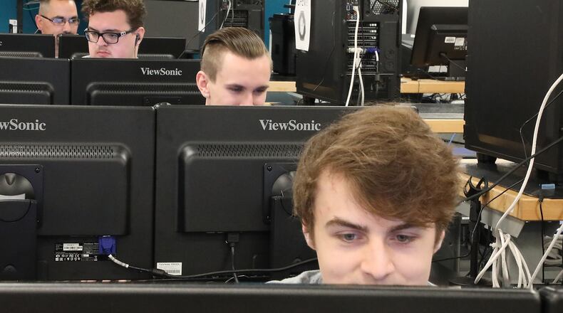 People work on computers in a cyber security class room at Clark State Community College . Bill Lackey/Staff
