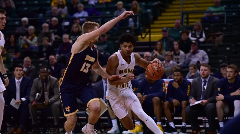 Mark Hughes drives past a Toledo defender during Wednesday night’s game at the Nutter Center. Joseph Craven/CONTRIBUTED