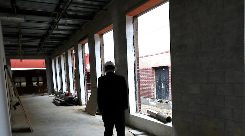 Greenon Local Schools' superintendent walks through construction on the district's new combined school building in October. The new school is slated to open in mid-2021. BILL LACKEY/STAFF