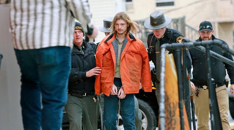 FILE - This Tuesday, Nov. 27, 2018 file photo shows Edward "Jake" Wagner being escorted by police into the holding area in the Pike County Common Pleas Court in Waverly, Ohio. Wagner planned to plead guilty to eight counts of aggravated murder. In exchange, prosecutors have dropped the possibility of a death sentence, Thursday, April 22, 2021. (Brooke LaValley/The Columbus Dispatch via AP, File)