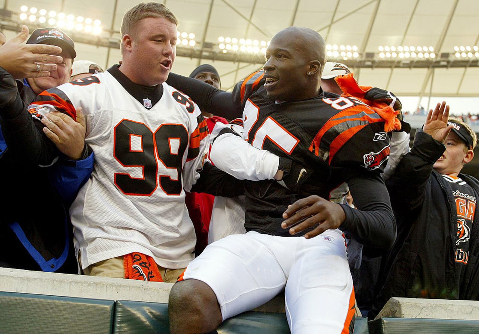 CINCINNATI - OCTOBER 26: Chad Johnson #85 of Cincinnati Bengals celebrates with fans in the seating area after the Bengals 27-24 win over the Seattle Seahawks on October 26, 2003 at Paul Brown Stadium in Cincinnati, Ohio. (Photo by Andy Lyons/Getty Images)