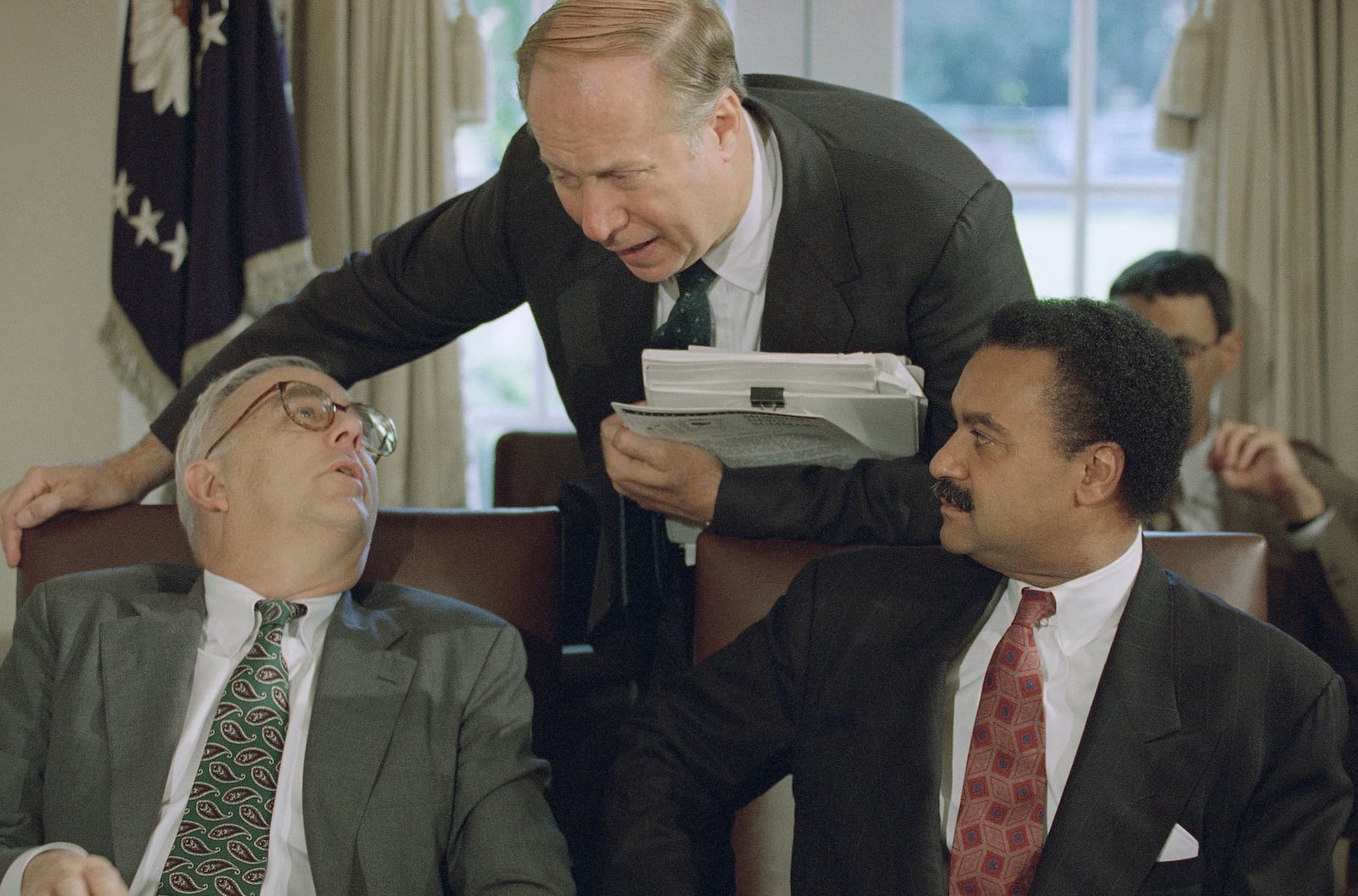 FILE - White House Communications Director David Gergen, center, talks to Defense Secretary Les Aspin, left, as Commerce Secretary Ron Brown looks on prior to the start of a Cabinet meeting at the White House in Washington on Sept. 30, 1993. (AP Photo/Wilfredo Lee, File)