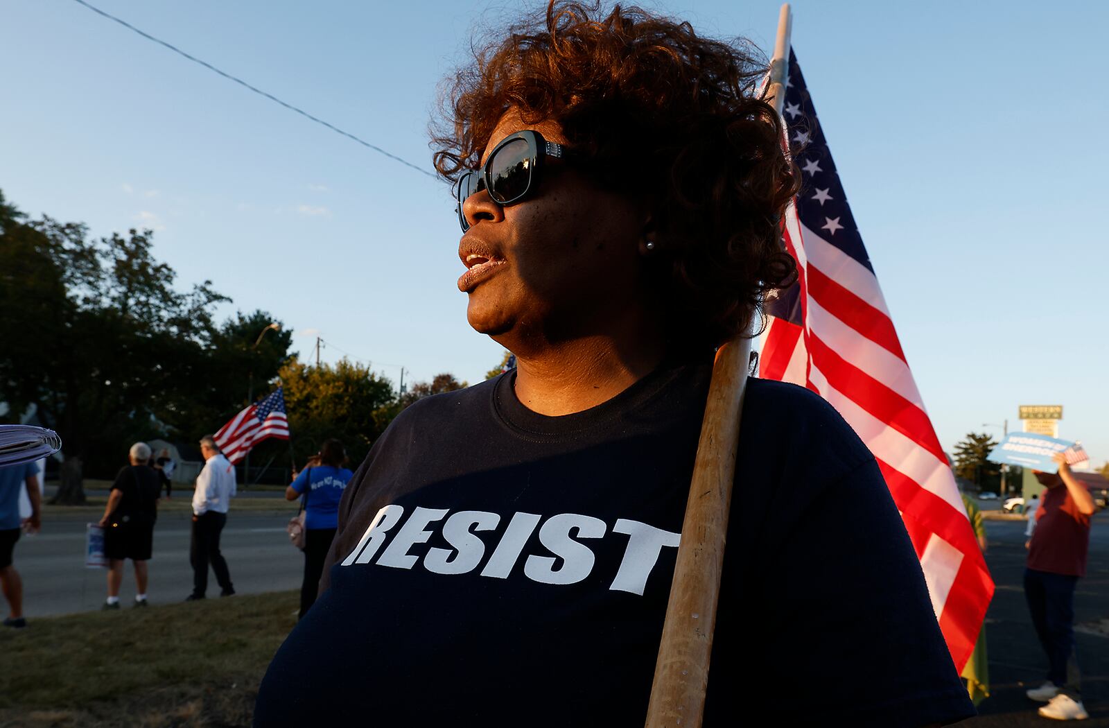 Shonda Sneed, from Yellow Springs, talks about the Haitian immigrants during a Peace Rally at the Clark County Democratic Party on Park Road in Springfield Wednesday. BILL LACKEY/STAFF