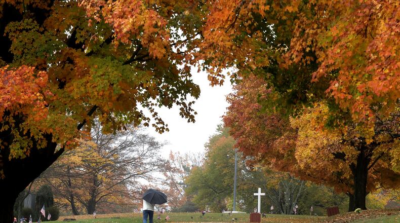 Several events will be held in Clark and Champaign counties this week, including Ferncliff Cemetery's 6th annual Mausoleum Crawl on Thursday. In this file photo, a man walked in the morning drizzle in the cemetery. FILE/BILL LACKEY/STAFF