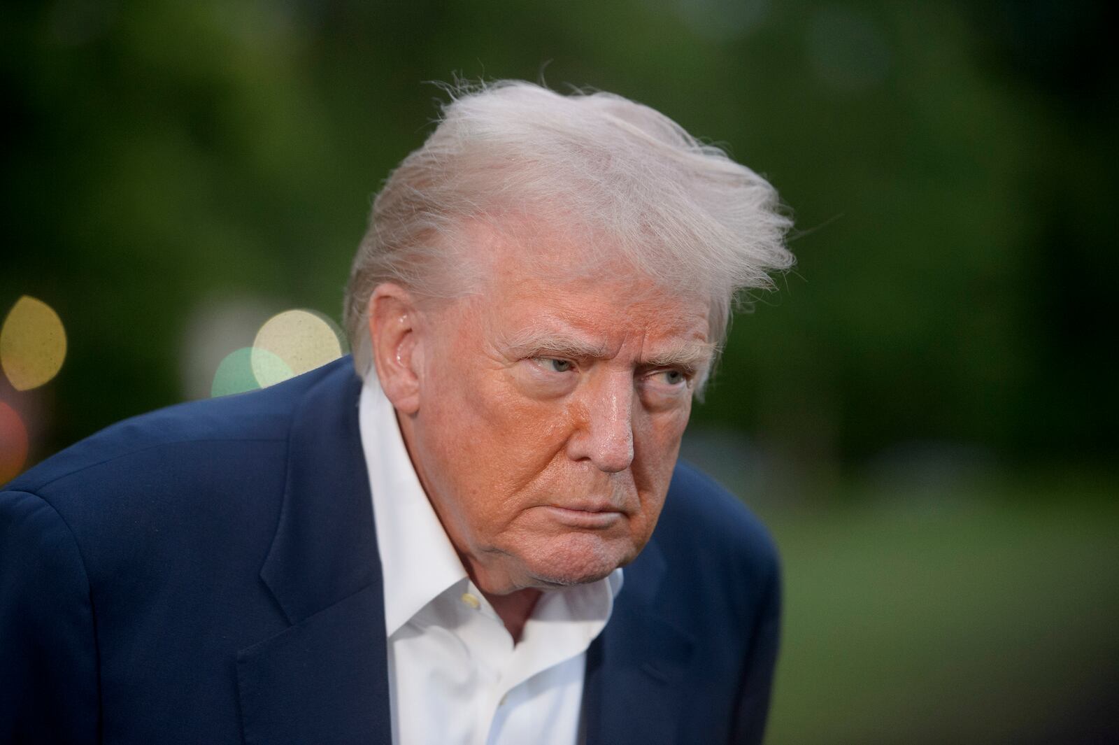 President Donald Trump speaks with reporters after disembarking Marine One upon arrival on the South Lawn of the White House in Washington, Sunday, May 4, 2025. (AP Photo/Rod Lamkey, Jr.)