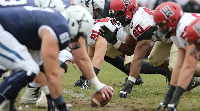 FILE - Harvard lines up against against Yale during an NCAA college football game on Saturday, Nov. 18, 2017, in New Haven, Conn. (AP Photo/Gregory Payan, File)