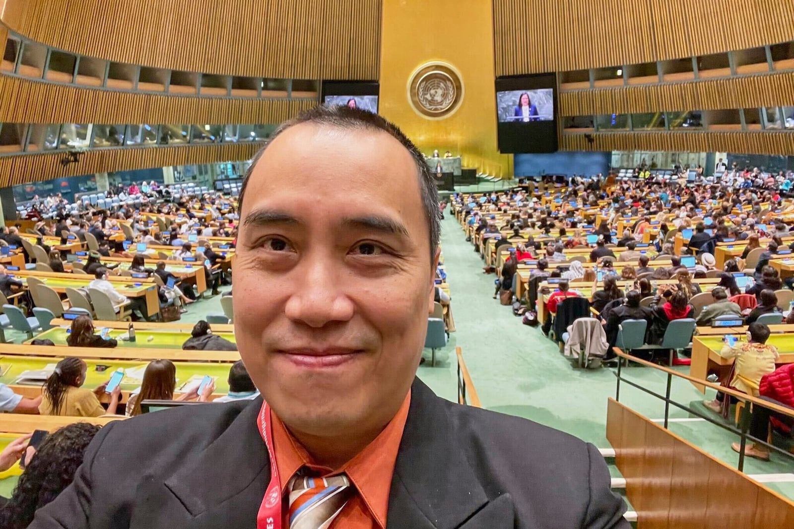 In this photo provided by Vy Lam shows Lam, a former adviser on Indigenous peoples at the U.S. Agency for International Development, on the floor of the United Nations during Sec. of the Interior Deb Haaland's speech at the Permanent Forum on Indigenous Issues on April 17, 2023, in New York. (Vy Lam via AP)