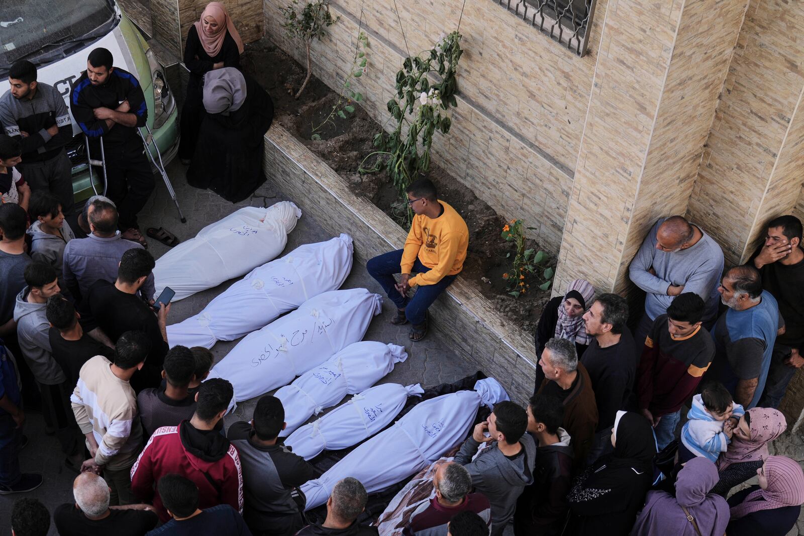 Palestinians grieve over the bodies of their relatives, who were killed in an Israeli airstrike, at the Baptist Hospital in Gaza City, on Thursday, April 3, 2025. (AP Photo/Jehad Alshrafi)