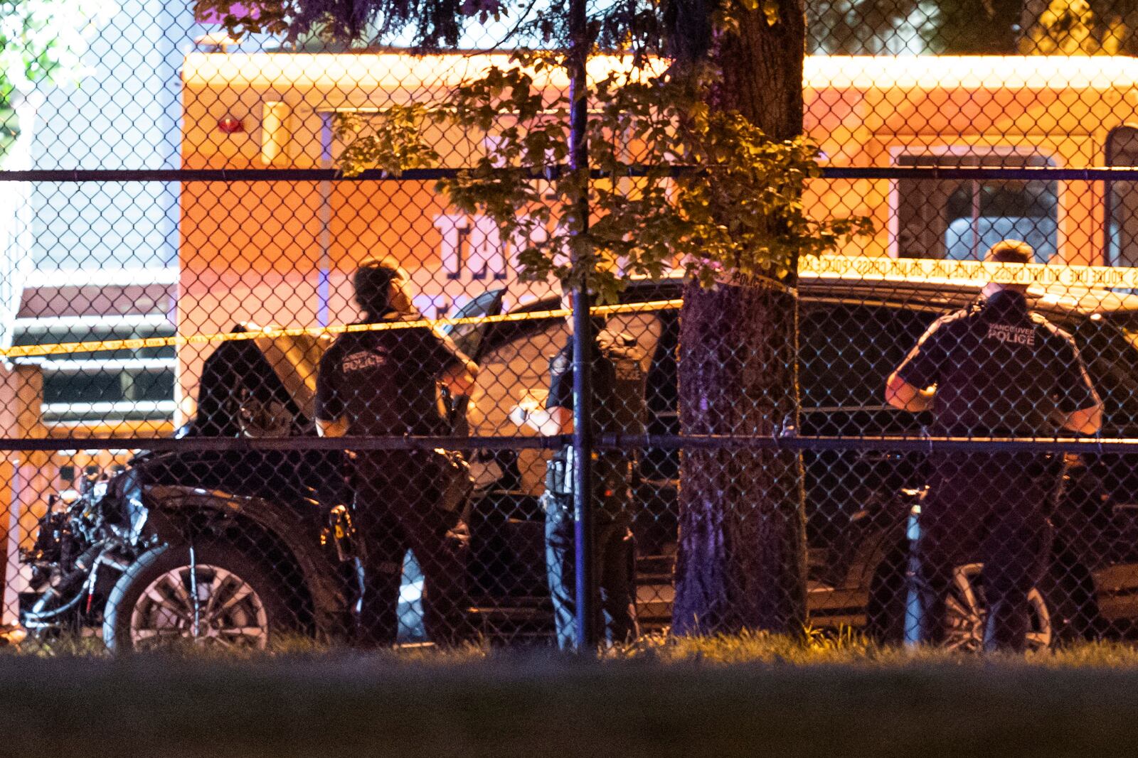 Vancouver police examine a black car suspected to be involved at a scene after a vehicle drove into a crowd at the Lapu Lapu Festival in Vancouver, British Columbia, Saturday April 26, 2025. (Rich Lam/The Canadian Press via AP)