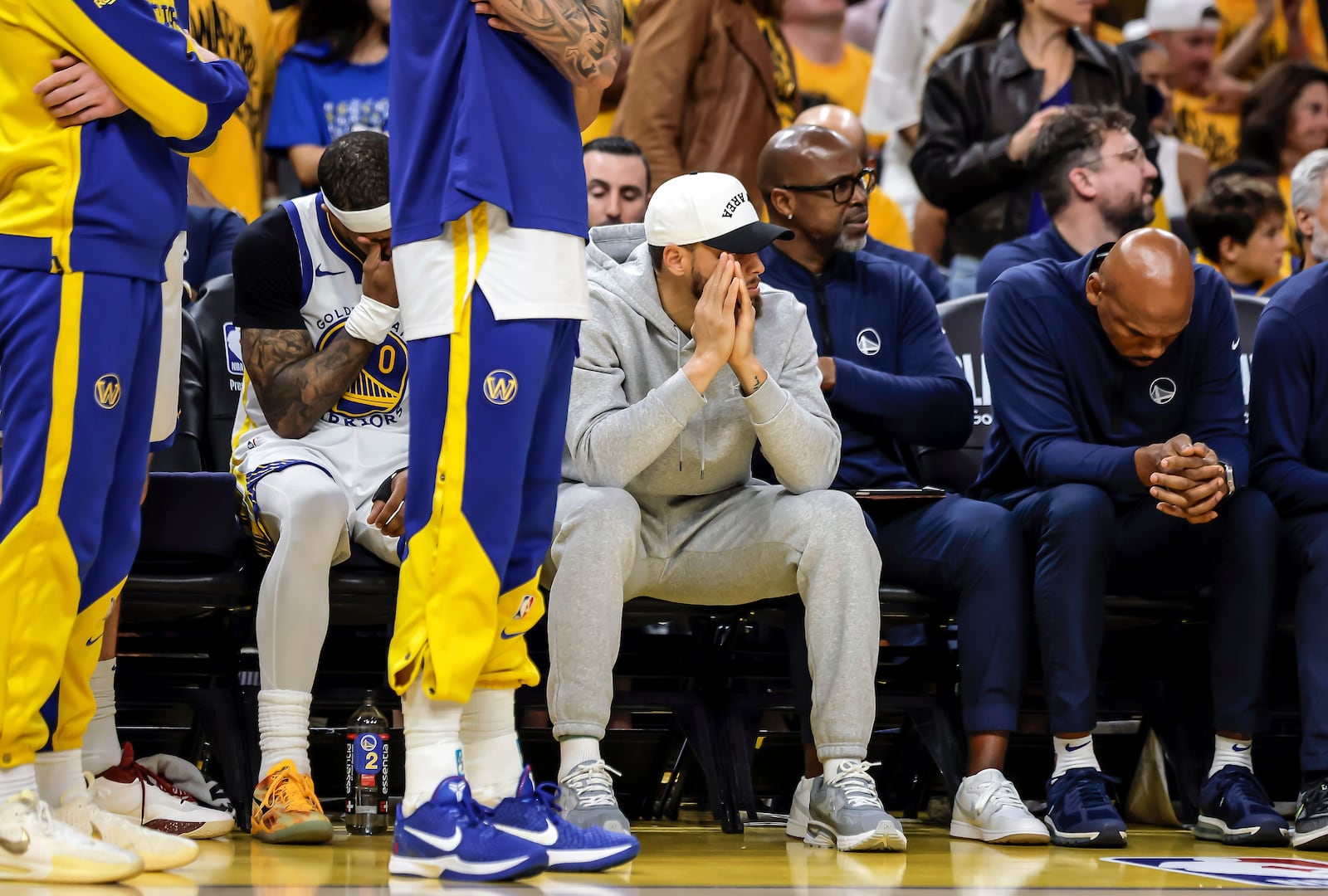 Golden State Warriors' Stephen Curry (30) and other players watch from the bench during Game 3 of an NBA basketball second-round playoff series against the Minnesota Timberwolves in San Francisco, Saturday, May 10, 2025. (Carlos Avila Gonzalez/San Francisco Chronicle via AP)