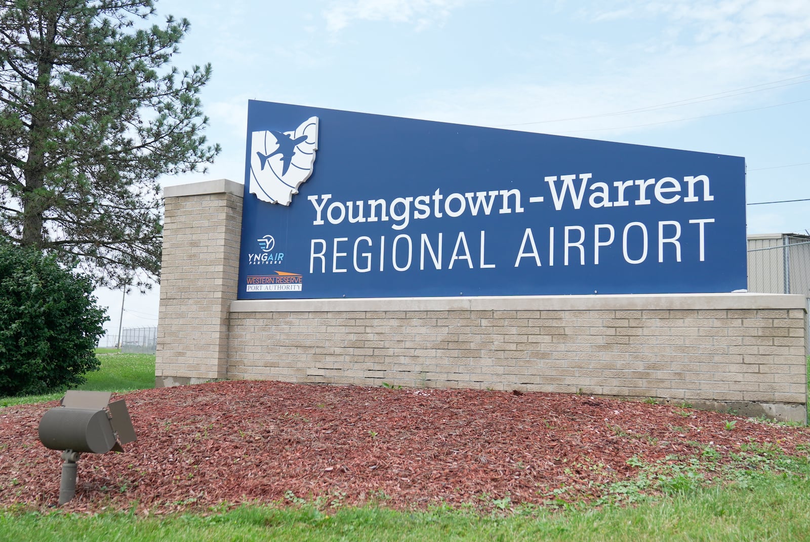 A sign for the Youngstown -Warren Regional Airport is pictured in Vienna, Ohio, Monday, June 30, 2025, where a day earlier a plane crashed on take off killing all onboard. (AP Photo/Sue Ogrocki)