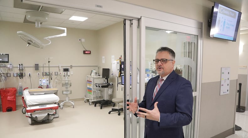 Ervin Gruia, administrator for the new Kettering Health Springfield, talks about the Emergency Department as he gives a tour of the new medical facility Friday, April 22, 2022. BILL LACKEY/STAFF