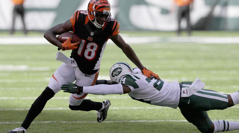 Darrelle Revis of the Jets tries to tackle Bengals wide receiver A.J. Green during their game at MetLife Stadium on September 11, 2016 in East Rutherford, New Jersey.
