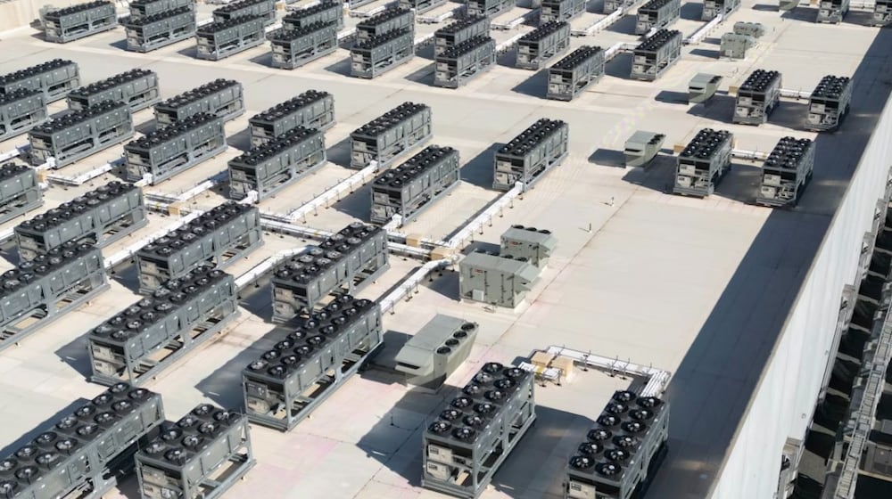 An aerial view shows cooling vent fans on the roof next to generators on the lower level of a data center in Ashburn, Va. Andrew Caballero-Reynolds/AFP via Getty Images