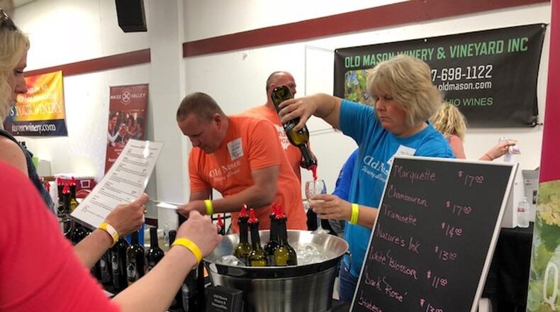 This was taken at the first-ever Vintage Ohio South wine festival that was held from 1 p.m. to 8 p.m. Saturday, May 12, 2018 inside a facility at the Clark County Fairgrounds in Springfield. The festival celebrated local wineries and wines from all over the state. MARK FISHER/STAFF