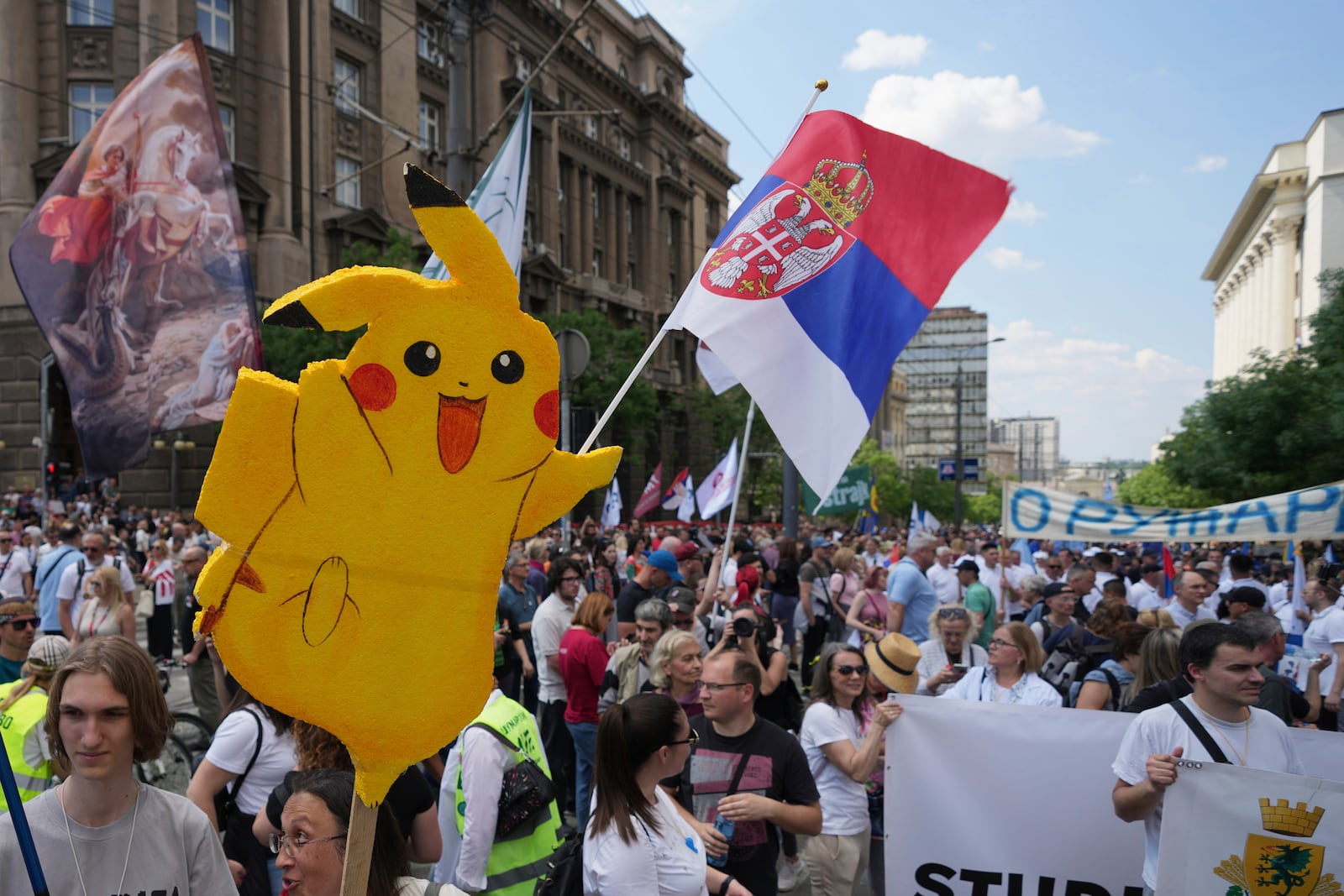University students and people protest in front of the government building, six months after the deadly train station tragedy that sparked mass demonstrations against corruption, in Belgrade, Serbia, Thursday, May 1, 2025. (AP Photo/Darko Vojinovic)