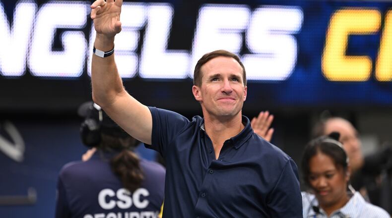FILE - Drew Brees waves to the crowd during the first half of an NFL football game between the Los Angeles Chargers and the Denver Broncos, Sunday, Sept. 21, 2025, in Inglewood, Calif. (AP Photo/Carrie Giordano, file)
