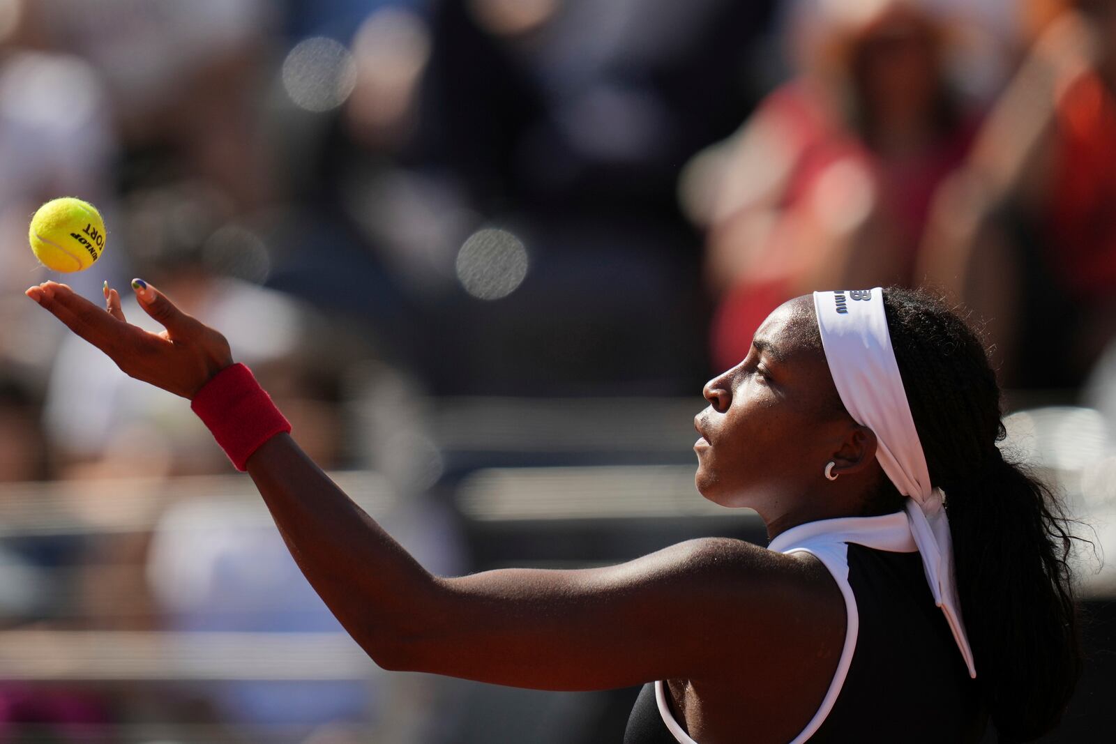 United States' Coco Gauff serves a ball to Britain's Emma Raducanu during their tennis match at the Italian Open at the Foro Italico, in Rome, Monday, May 12, 2025. (AP Photo/Alessandra Tarantino)