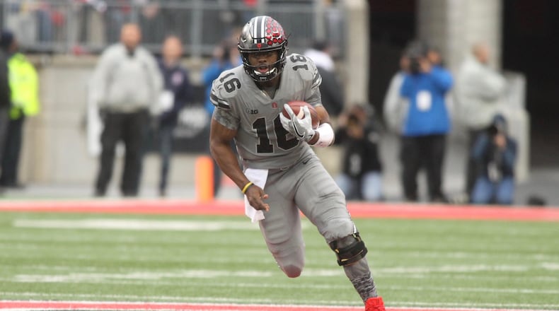 Ohio State’s J.T. Barrett runs against Penn State on Saturday, Oct. 28, 2017, at Ohio Stadium in Columbus. David Jablonski/Staff