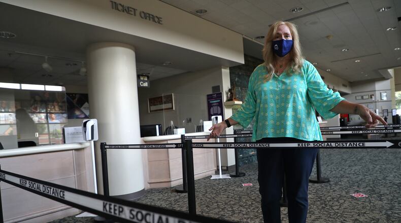 Adele Adkins, executive director of the Clark State Performing Arts Center, talks about some of the items they'll be using to keep people safe when they reopen. BILL LACKEY/STAFF