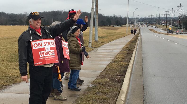 Picketers stand outside an entrance to the Dayton campus of Wright State University on Colonel Glenn Highway. The AAUP-WSU was on strike for 20 days this year.