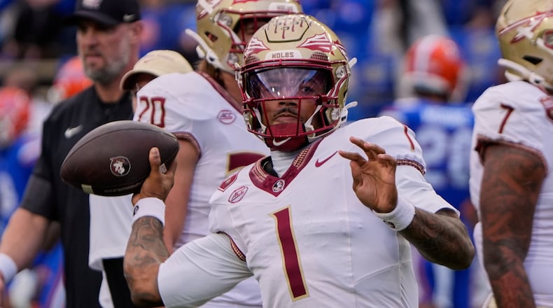 Florida State quarterback Tommy Castellanos warms up before an NCAA college football game against Florida, Saturday, Nov. 29, 2025, in Gainesville, Fla. (AP Photo/John Raoux)
