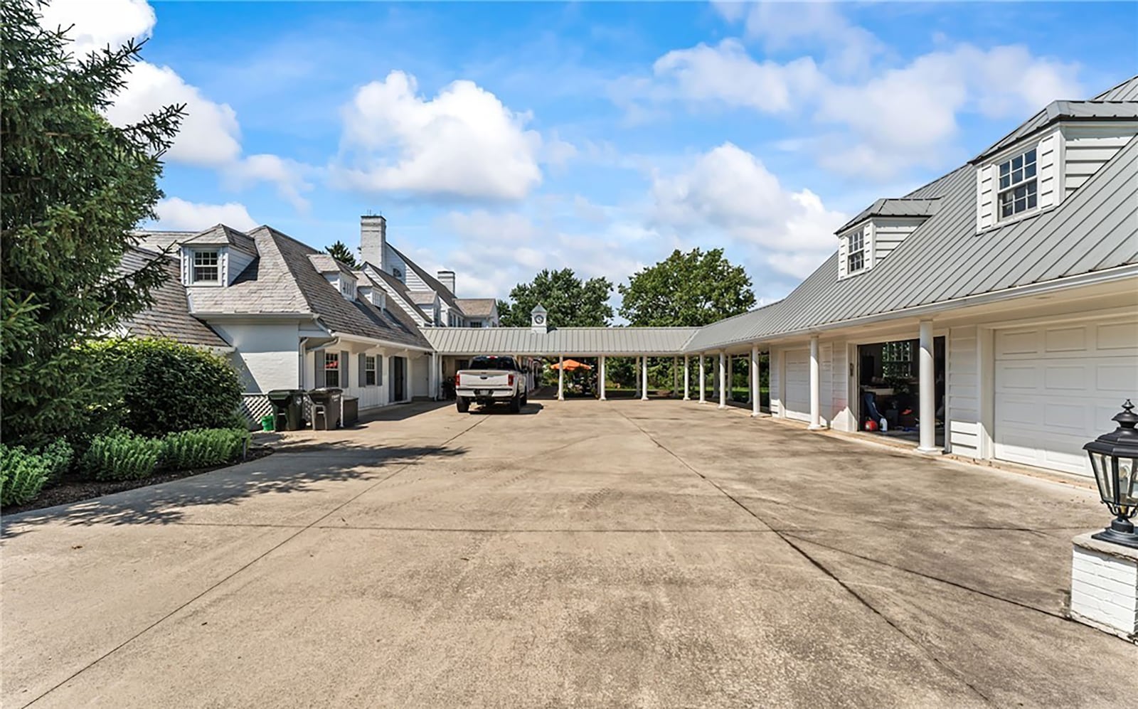 The garage courtyard leads to the four car garage and guest house, which is connected to the main house by a brick paver breezeway. CONTRIBUTED