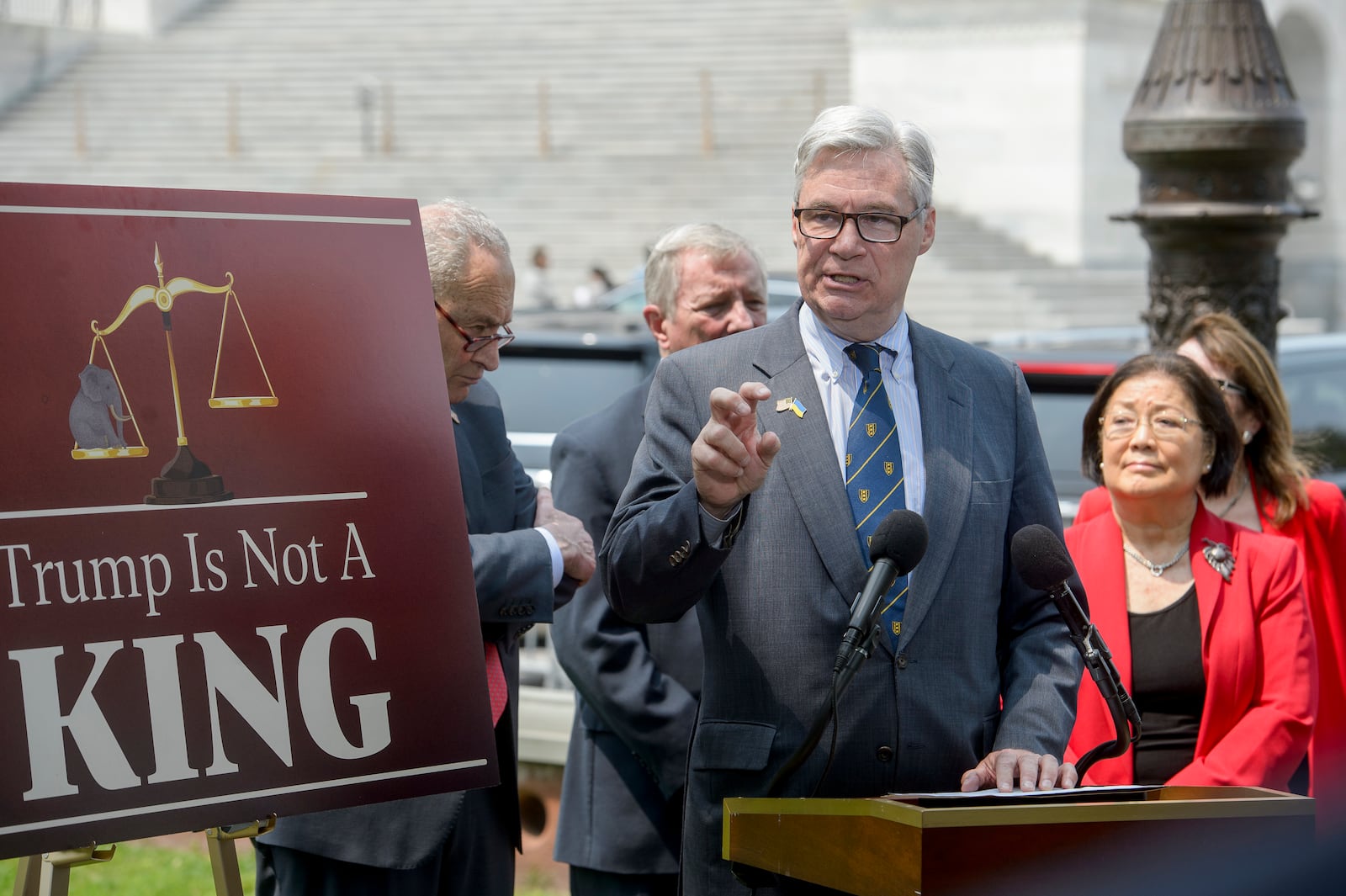 Sen. Sheldon Whitehouse, D-R.I., speaks as Senate Minority Leader Chuck Schumer, D-N.Y., in background from left, Sen. Dick Durbin, D-Ill., and Sen. Mazie Hirono, D-Hawaii, listen during a news conference regarding provisions in the House-passed Republican One Big, Beautiful Bill Act, at the Capitol, Thursday, June 5, 2025, in Washington. (AP Photo/Rod Lamkey, Jr.)