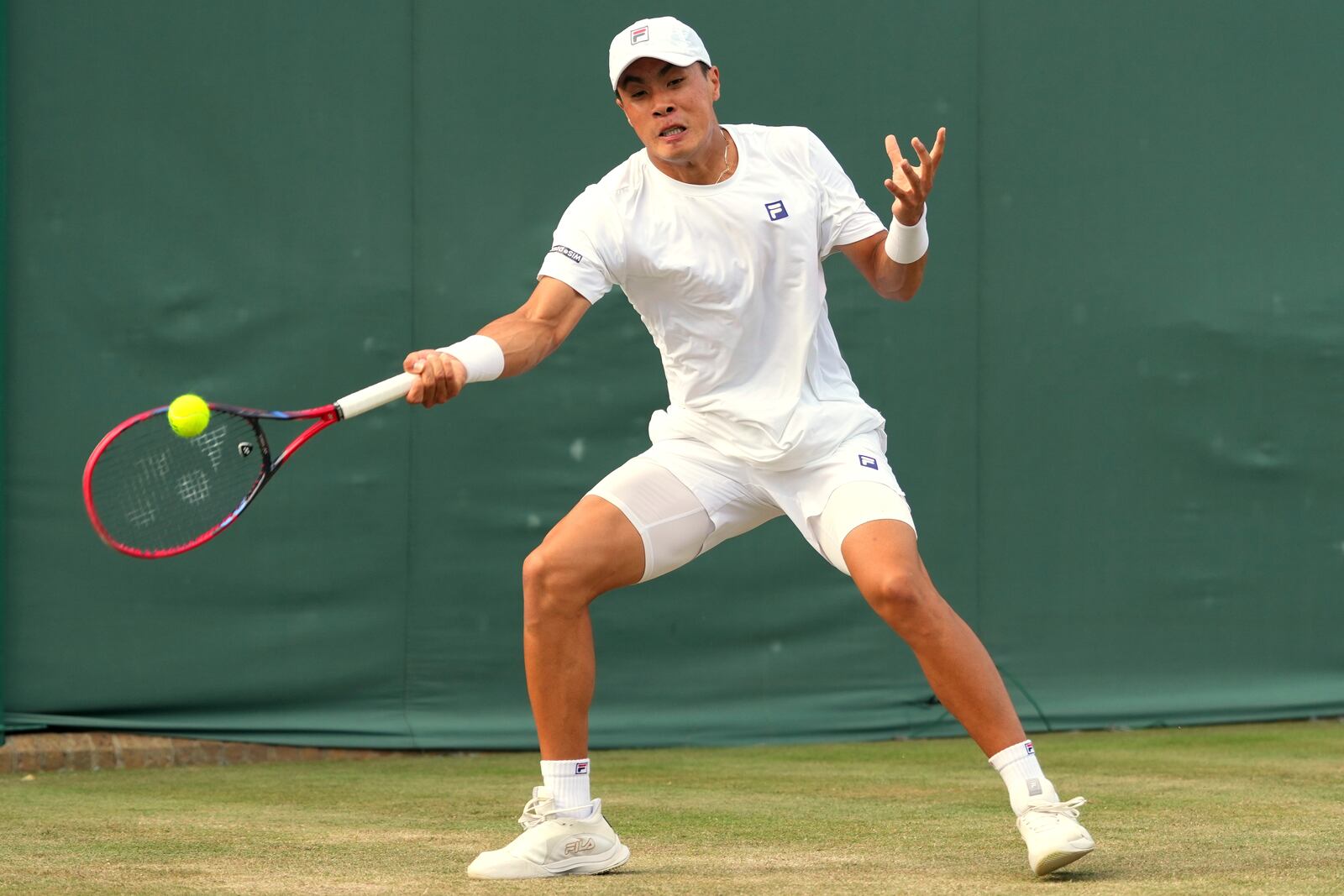 Brandon Nakashima of the U.S. returns to Reilly Opelka of the U.S. during their second round men's singles match at the Wimbledon Tennis Championships in London, Thursday, July 3, 2025.(AP Photo/Kirsty Wigglesworth)