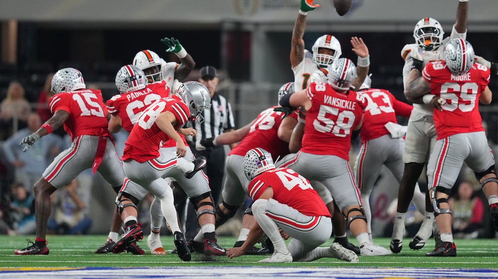 Ohio State kicker Jayden Fielding, with Joe McGuire holding, misses a field goal against Miami during the first half of the Cotton Bowl College Football Playoff quarterfinal game Wednesday, Dec. 31, 2025, in Arlington, Texas. (AP Photo/Julio Cortez)
