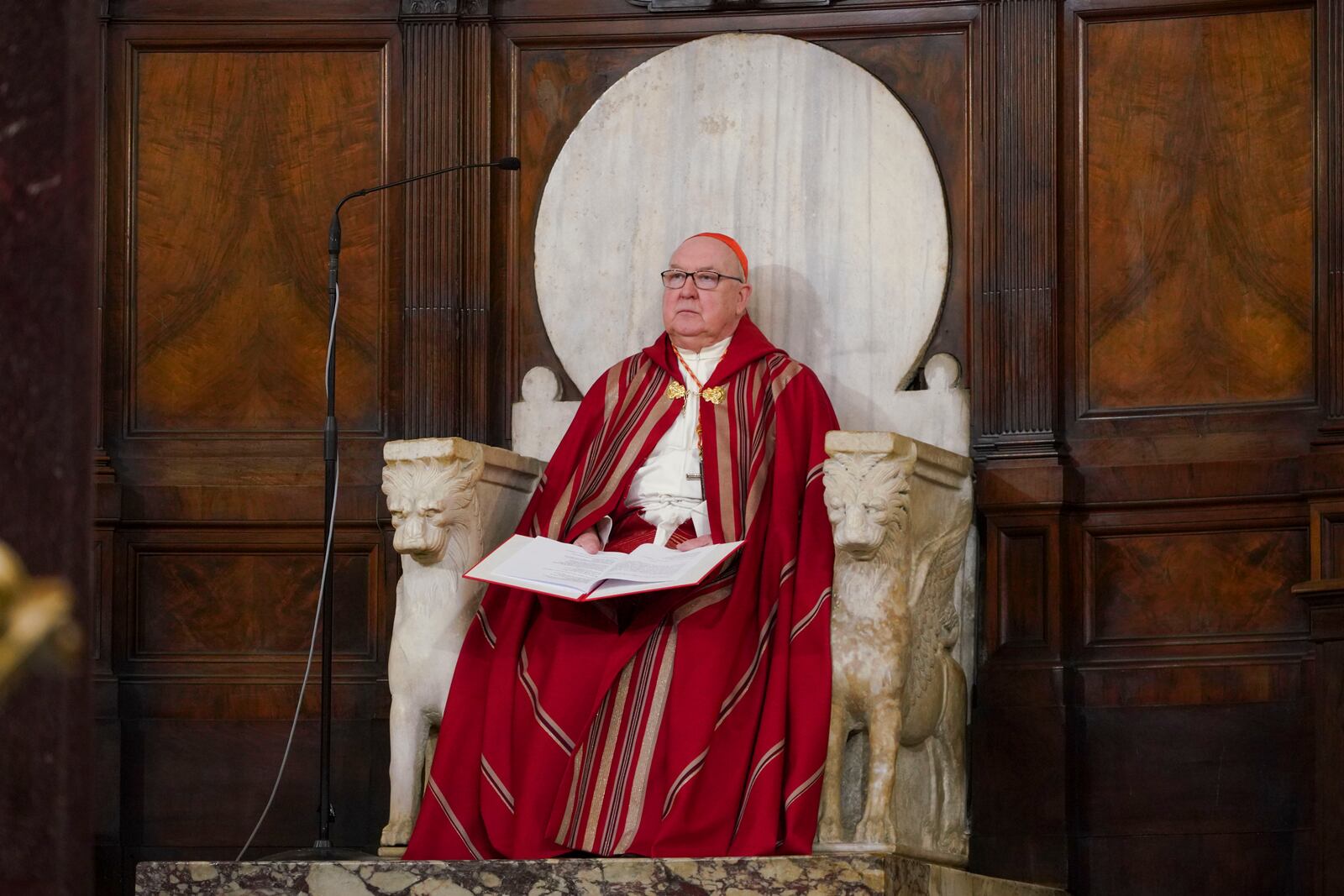 FILE - U.S. Cardinal Kevin Joseph Farrell presides over a vigil service over the death of George Floyd, a Black man who died after being restrained by Minneapolis police officers, in Rome's Santa Maria in Trastevere Church, June 5, 2020. (AP Photo/Andrew Medichini)