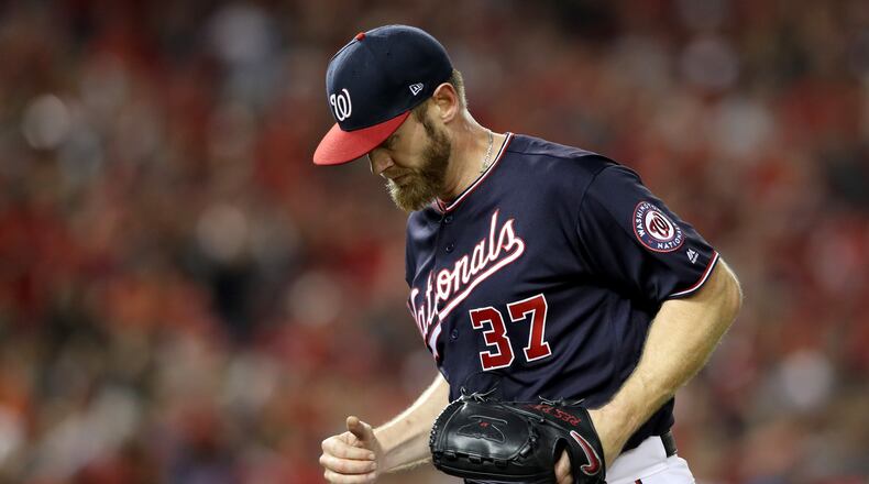WASHINGTON, DC - OCTOBER 14: Stephen Strasburg #37 of the Washington Nationals runs off the mound after retiring his side in the third inning during game three of the National League Championship Series against the St. Louis Cardinals at Nationals Park on October 14, 2019 in Washington, DC. (Photo by Rob Carr/Getty Images)