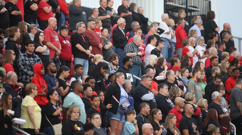 Wayne fans stand for the national anthem before a game against Springfield on Friday, Sept. 8, 2023, in Huber Heights. David Jablonski/Staff