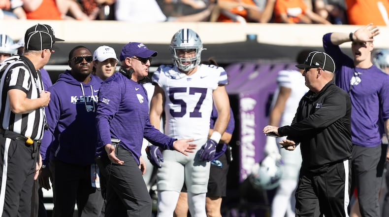 Kansas State head coach Chris Klieman talks to officials on the sidelines in the first half of an NCAA college football game against Oklahoma State Saturday, Nov. 15, 2025, in Stillwater, Okla. (AP Photo/Mitch Alcala)