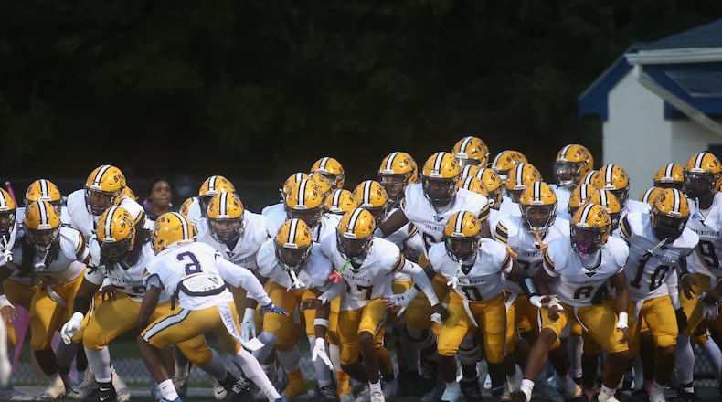 Springfield prepares to take the field before a game against Fairmont on Friday, Oct. 17, 2025, at Roush Stadium in Kettering. David Jablonski/Staff