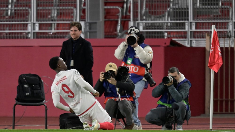 Monaco's Folarin Balogun celebrates after scoring the opening goal during the first-leg of the Champions League playoff soccer match between Monaco and Paris Saint-Germain in Monaco, Tuesday, Feb. 17, 2026. (AP Photo/Philippe Magoni)