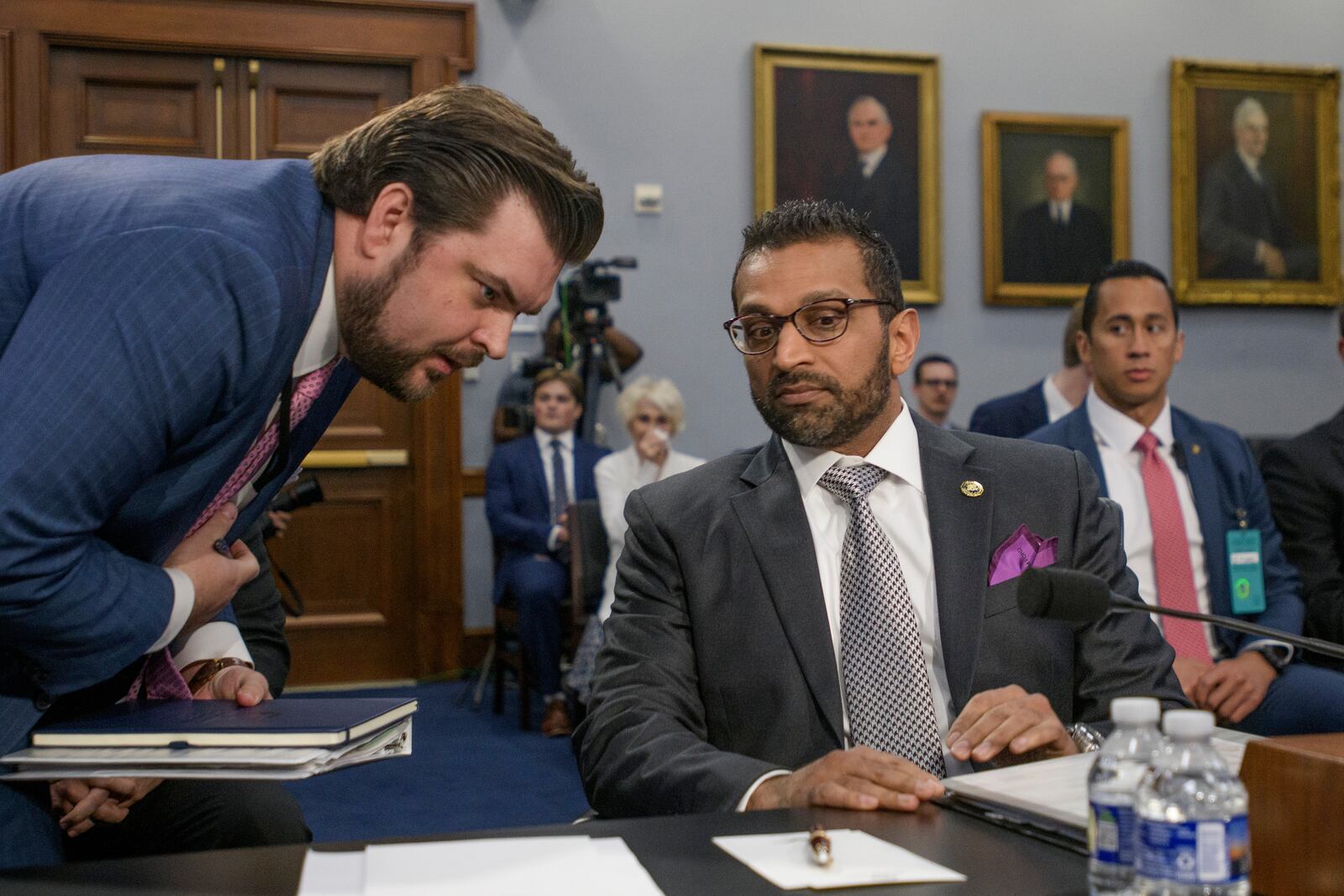 FBI director Kash Patel, right, confers with staff during a House Committee on Appropriations, Subcommittee on Commerce, Justice, Science, and Related Agencies budget hearing on the Fiscal Year 2026 Request for the Federal Bureau of Investigation, on Capitol Hill, Wednesday, May 7, 2025, in Washington. (AP Photo/Rod Lamkey, Jr.)