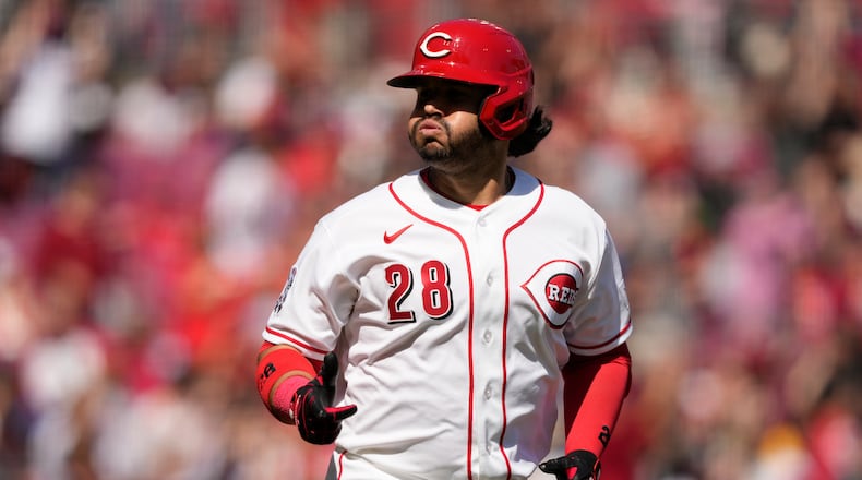 Cincinnati Reds' Eugenio Suárez reacts as he rounds the bases after hitting a three-run homer during the sixth inning of a baseball game against the Boston Red Sox in Cincinnati, Sunday, March 29, 2026. (AP Photo/Carolyn Kaster)