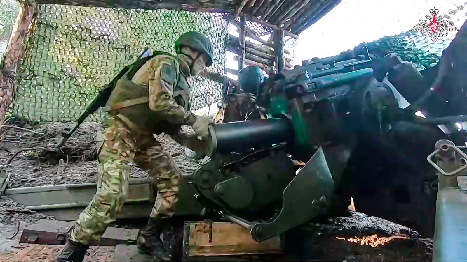 In this photo taken from video distributed by Russian Defense Ministry Press Service on Tuesday, June 24, 2025, a Russian soldier prepares Giatsint-B 152 mm field gun to fire towards Ukrainian position on an undisclosed location in Ukraine. (Russian Defense Ministry Press Service via AP)