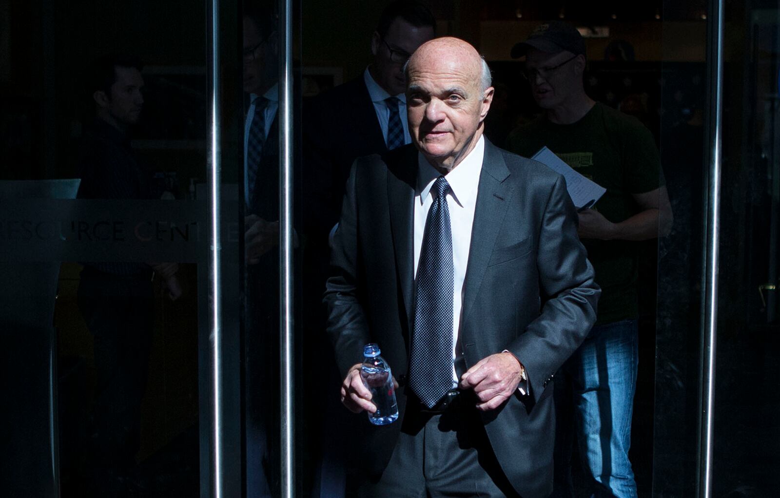 FILE - In this Sept. 22, 2016, file photo, Lou Lamoriello leaves an NHL hockey news conference in Toronto. (Chris Young/The Canadian Press via AP, File)