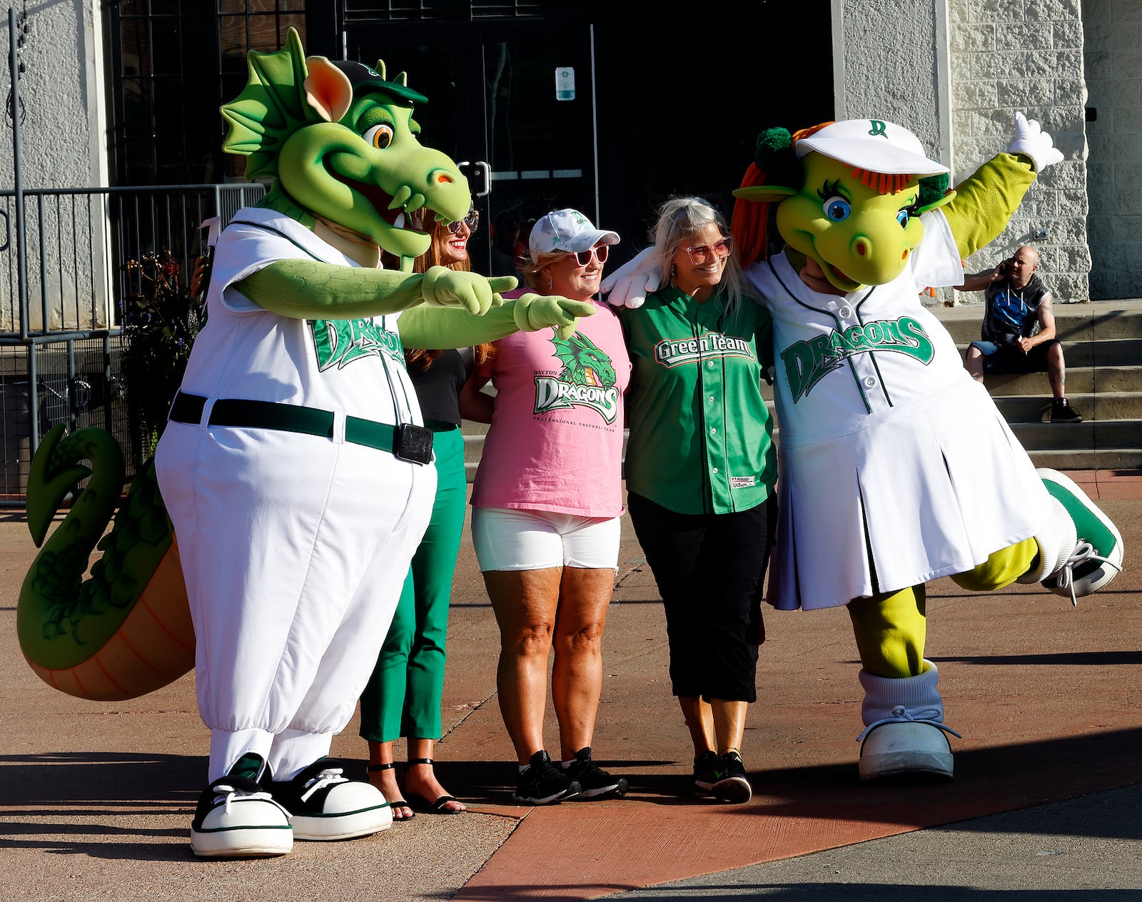The Dayton Dragons baseball team Mascots Heater and Gem pose for photos with fans before a game Wednesday, Aug. 21, 2024. MARSHALL GORBY\STAFF