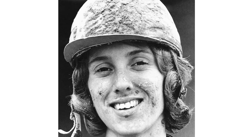 FILE - Jockey Diane Crump sports a mud pack on her cap and face after winning a Kentucky Derby race riding Right Sean, in Louisville, Kentucky, May 2, 1970. Crump, who in 1969 became the first woman to ride professionally in a horse race and a year later became the first female jockey in the Kentucky Derby, died Thursday, Jan. 1, 2026. She was 77. (AP Photo, File)