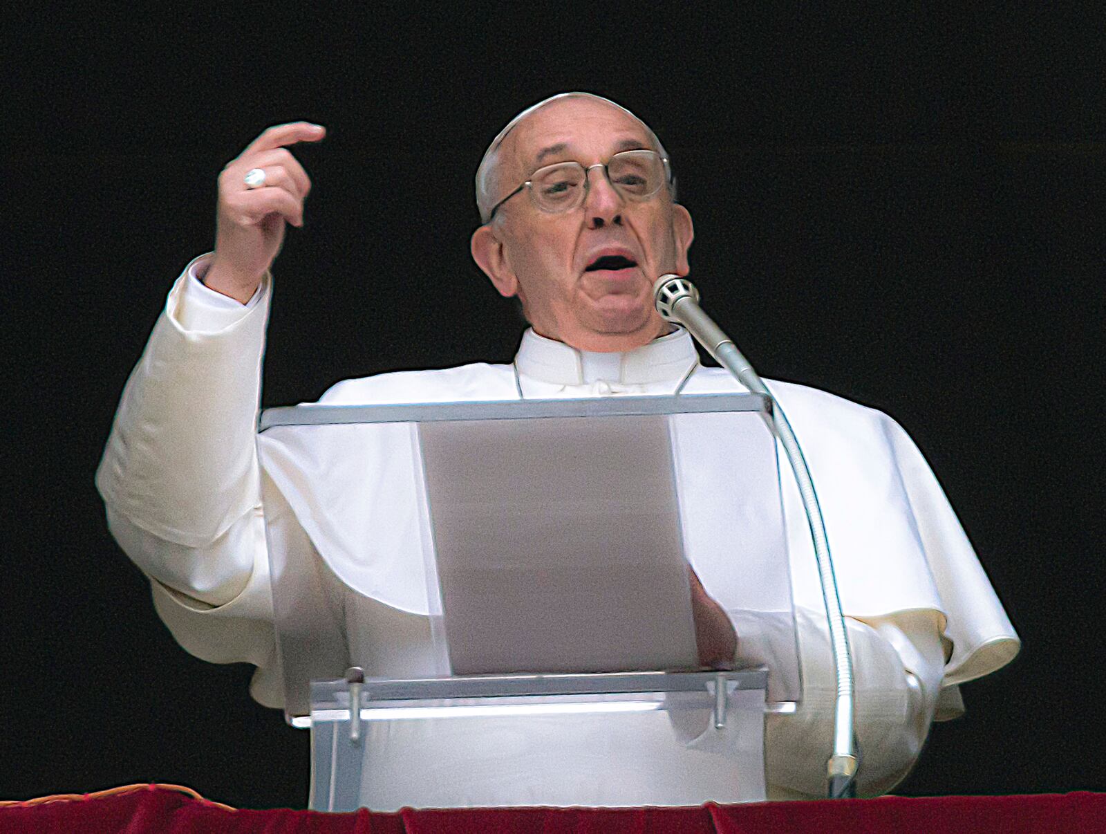 FILE - Pope Francis gestures on the first Sunday window appearance of his papacy to pray the Angelus and bless the faithful gathered in St. Peter's Square at the Vatican, Sunday, March 17, 2013. (AP Photo/Domenico Stinellis, File)