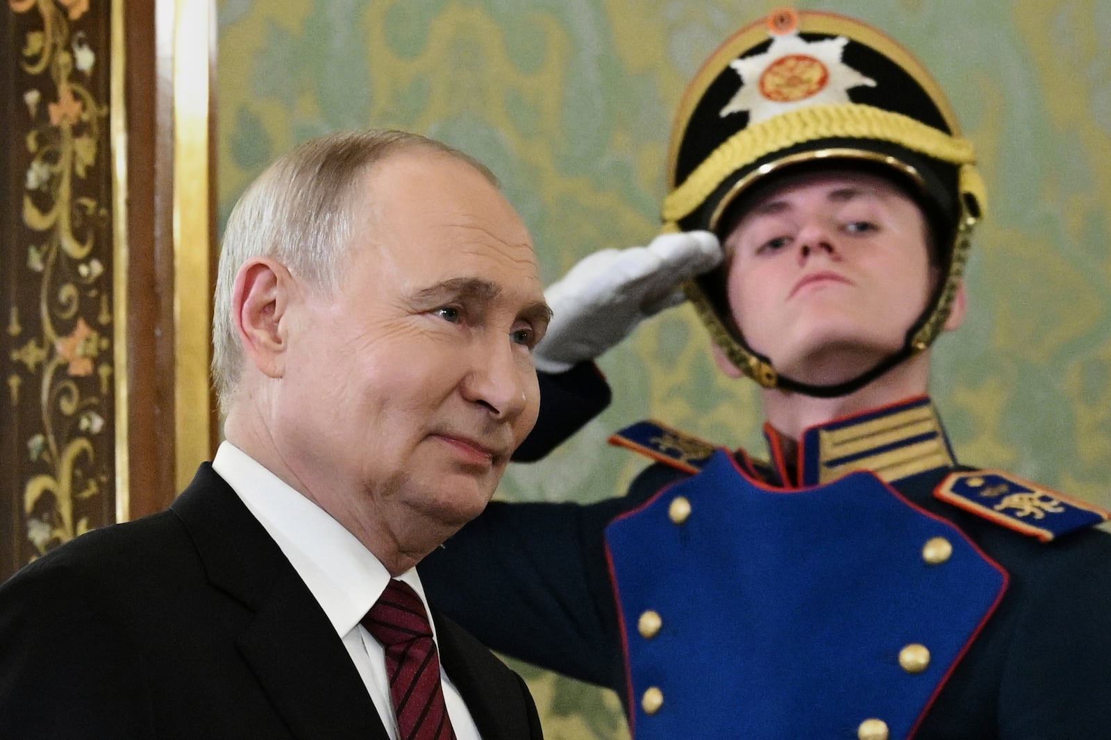 Russian President Vladimir Putin enters a hall to meet South Ossetian President Alan Gagloyev in the Grand Palace at the Kremlin in Moscow, Russia, on Saturday, May 10, 2025, during celebrations of the 80th anniversary of the Soviet Union's victory over Nazi Germany during the World War II. (Sergei Bobylev/RIA Novosti via AP)